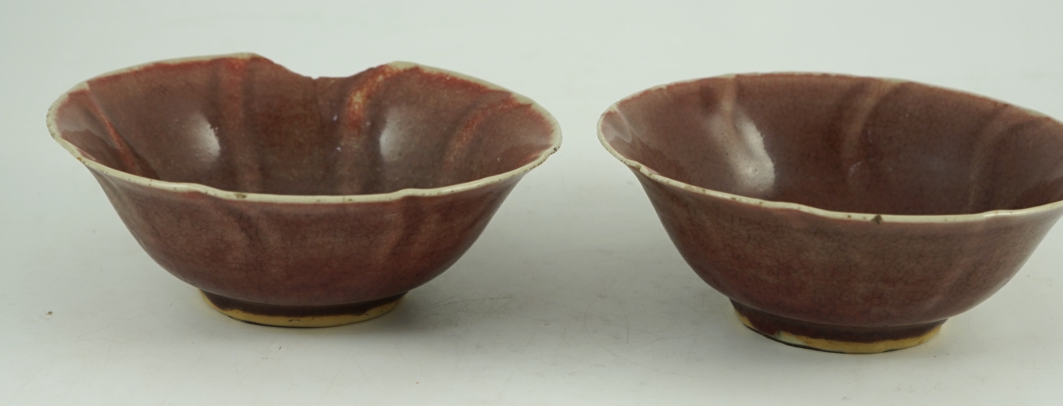 A pair of Chinese sang-de-boeuf glazed bowls, Langyao hong, Kangxi period, 19.5 cm diameter, some damage
